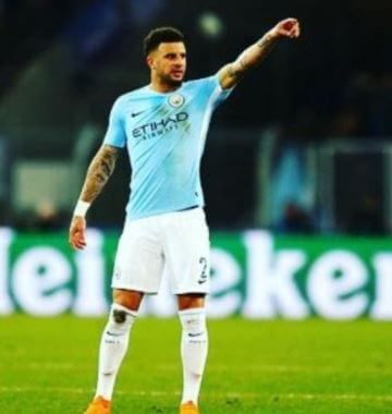 Roman Walker father Kyle Walker in the field.